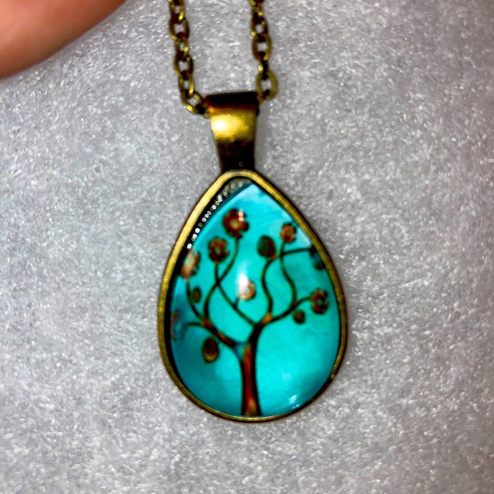 Beautiful teardrop teal green/blue color charm with bronze color chain